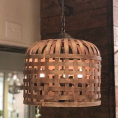 a wooden light fixture hanging from a ceiling