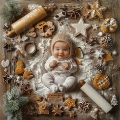 a baby is surrounded by cookies and other christmas decorations on a wooden background with snowflakes