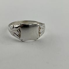 A solid silver ring. The ring is made in the style of an un-inscribed (blank) signet ring, presenting a smooth silver panel with chased decoration to the shoulders of the ring.  Ring size uk Z, us 12.5, eu 69 Men Silver Ring, Mens Ring Designs, Rings Men, Mens Ring, Multi Stone Ring, Multi Stone, Ring Ring, Signet Ring, Stone Rings