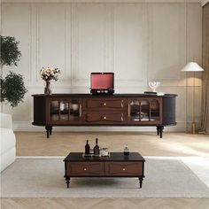 a living room scene with focus on the coffee table and sideboard in the middle