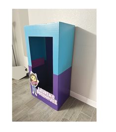 a purple and blue cardboard box sitting on the floor