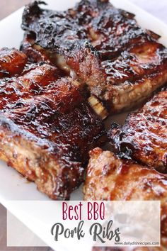 barbecue pork ribs on a white plate with bbq sauce in the middle and text overlay that reads best bbq pork ribs