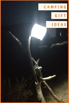 a light that is sitting on top of a tree branch in the dark with text reading camping gift ideas