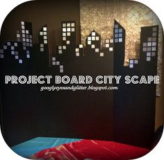 the project board cityscape is made out of black paper and cut into squares