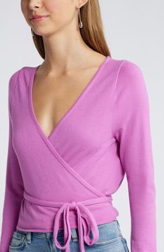 It's a wrap on this sustainably made sweater featuring a waist-tie closure that ensures a fabulous figure-hugging fit every time. 17 1/2" length (size Medium)   Surplice V-neck   Long sleeves   50% Lenzing™ EcoVero™ viscose, 28% polyester, 22% nylon   Lenzing EcoVero viscose is a sustainably produced fiber using pulp made from renewable wood sources and certified with the EU Ecolabel for high environmental standards, including lower emissions and water usage than generic viscose   Hand wash, dry Water Usage, Wrap Sweater, Pink Sweater, Rose Buds, Waist Tie, Sweater Top, Top Brands, Hand Wash, Nordstrom