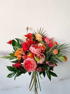 a bouquet of flowers sitting on top of a table