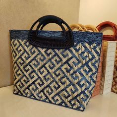 Handwoven Tote Bag with Ethnic Pattern - Dark Blue Top Handle Bag Hey there! I'm so excited to introduce you to this gorgeous handwoven straw tote bag with an ethnic pattern, exclusively available in my Etsy shop. This unique piece features beautiful dark blue and beige colors, crafted entirely by hand with love. The colorful raffia adds a vibrant touch, making it the perfect summer handbag. **Why You'll Love This Bag - **Exclusive Design This bag is truly one-of-a-kind. You won't find it anywhe Blue Bags With Bamboo Handle For Everyday Use, Blue Everyday Bags With Bamboo Handle, Blue Top Handle Straw Bag For Travel, Blue Top Handle Shoulder Bag For Vacation, Blue Tote Bag With Bamboo Handle, Blue Tote Bags With Bamboo Handle, Rectangular Woven Travel Bag, Rectangular Travel Bag With Weaving, Bohemian Straw Bag With Bamboo Handle For Shopping