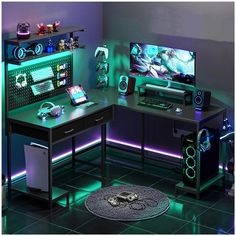 a computer desk with two monitors and speakers on it, lit up by neon lights