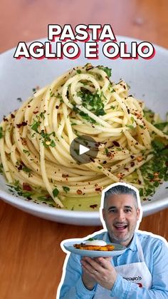 a man holding a plate of pasta in front of a bowl with the words pasta aglio e olio on it