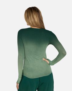 Made in LA 95% Siro Viscose 5% Spandex Wash Cold, Lay Flat to Dry ML Signature Soft Rib Knit Fabric Thumbhole Cutouts Fitted Silhouette Reactive Dye Stretch Fit Model & Fit Info Modeled in Size S Fitted Tee, Size Up If Unsure Height: 5' 9" / Waist: 23" / Bust: 31" / Hip: 34" Stretch V-neck Tops With Thumbholes, Fitted Long Sleeve Modal Top, Fitted Modal Long Sleeve Tops, Green Fitted Long Sleeve T-shirt, Trendy Tops With Thumbholes For Loungewear, Scoop Neck Tops With Thumbholes For Spring, Stretch Modal Long Sleeve Tops, Seamless Long Sleeve Summer Tops, Seamless Long Sleeve Tops For Summer