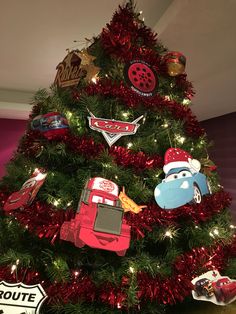 a christmas tree decorated with cars and magnets