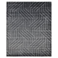 a black and white rug with an abstract design