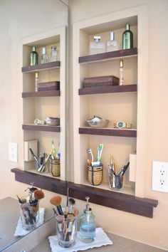 the bathroom sink is clean and ready to be used as a medicine cabinet for toothbrushes