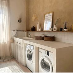 a washer and dryer in a small room