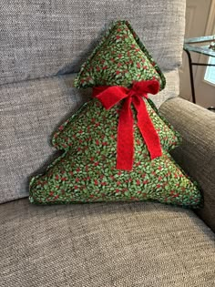 Our new Holly fabric  pillow has been very popular at our shows this year.  We were very lucky to find such a special Christmas fabric to make these with.  You can expect small flaws since it is a vintage item.  The back of the pillow is made from a green felt or fleece fabric.  The bow on the pillow is made from fabric and can be removed if you wish.  The pillow is not weighted so it will need to be leaned against something to sit up. The measurements are approximately 15 inches tall and 15 inches wide at the widest point on the bottom of the pillow. Christmas Tree Pillow Pattern, Fabric Christmas Gifts, Pillow Wreath, Christmas Stockings Ideas, Mini Pillows, Christmas Gift Tags Diy, Christmas Tree Quilt, Frugal Christmas, Christmas Tree Template