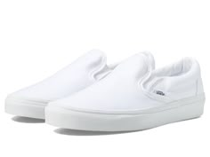 Vans Classic Slip-On - Shoes : True White (Canvas) : The Vans Classic Slip-On is a pop culture icon, known for its ability to dress up or down. Canvas upper (unless otherwise noted in color name). Supportive padded collar. Elastic side accent. Signature rubber waffle outsole. Round toe silhouette. Low profile. Imported. Measurements: Weight: 14 oz Product measurements were taken using size Men's 9.5, Women's 11, width Medium. Please note that measurements may vary by size. Slip On Vans, Men Wedding Attire Guest, White Slip On Vans, White Canvas Shoes, Vans White, White Vans, Vans Slip On, White Slip, Vans Classic Slip On