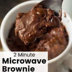 a spoon full of brownie in a white bowl with the words 2 minute microwave brownie mix