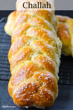 two loaves of bread sitting on top of a cooling rack