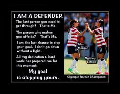 two women soccer players giving each other a high five