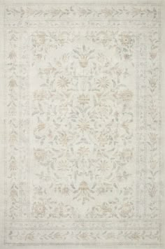 a white rug with an ornate design on it