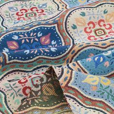 an old rug with colorful designs on it