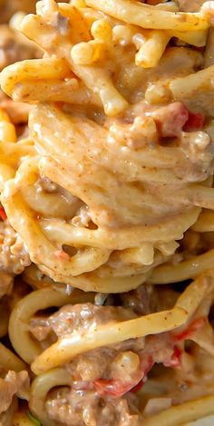 pasta with meat and cheese is piled on top of each other