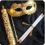 two golden masquerades and one white stick