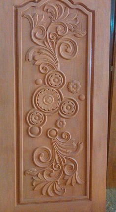 carved wooden door with decorative design on the front and side panel, made from wood