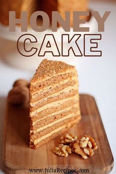 there is a piece of cake on the cutting board with walnuts next to it