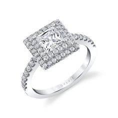 a square cut diamond engagement ring with pave set diamonds on the shoulders and sides