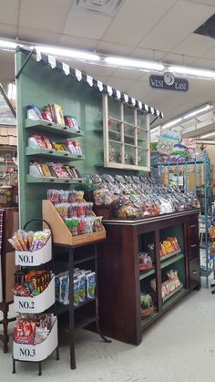 the inside of a grocery store filled with lots of food and snacks on display in bins