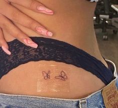 a woman's stomach with the word love written in cursive writing on it