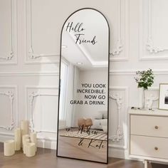 a large mirror with the words hello friends on it in front of a white wall