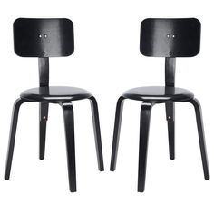 two black chairs sitting next to each other on top of a white background with the same chair