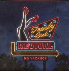 a neon sign that reads trophy bar revival no vacancy