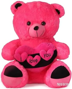 a pink teddy bear with i love you written on it's chest holding a heart