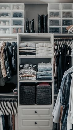 an organized closet with clothes and shoes