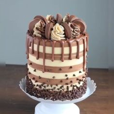 a chocolate cake with white and brown frosting