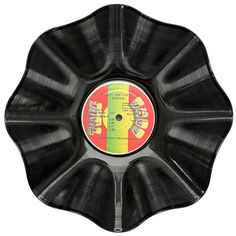 an old vinyl record in the shape of a flower