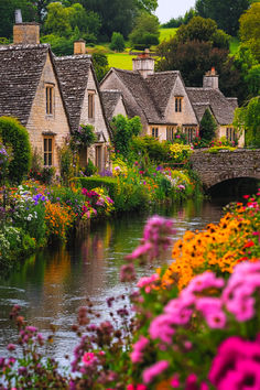 A picturesque scene of a quaint English cottage in the Cotswolds, surrounded by vibrant flowers, with a charming stone bridge crossing over a peaceful stream, capturing the essence of Cotswold villages and the beauty of the England countryside. Bibury England, Old Village, Stone Cottages, Wallpaper Tumblr, Beaux Villages, Beautiful Villages, Stone Houses, Green Life