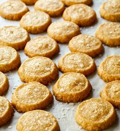 some cookies are sitting on a baking sheet and ready to be baked in the oven