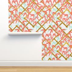 an abstract wallpaper design with gold and pink bamboo leaves on white paper next to a wooden floor