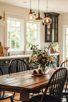 a dining room table with chairs around it