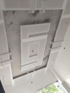 the inside of a room that is being remodeled with white paint on the walls and ceiling