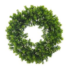 a green wreath with white flowers and leaves