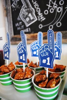 small cups filled with food sitting on top of a table