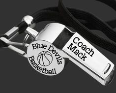 a coach and basketball keychain on a black cord with the words coach alderman