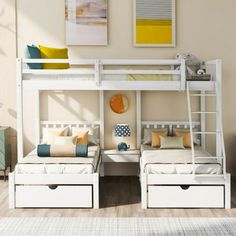 two white bunk beds sitting next to each other on top of a hard wood floor