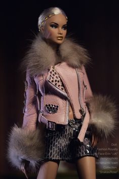 a mannequin wearing a pink jacket and black skirt with fur trimmings