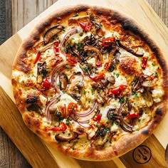 a pizza sitting on top of a wooden cutting board